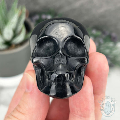Polished Silver Sheen Obsidian Skull Carving