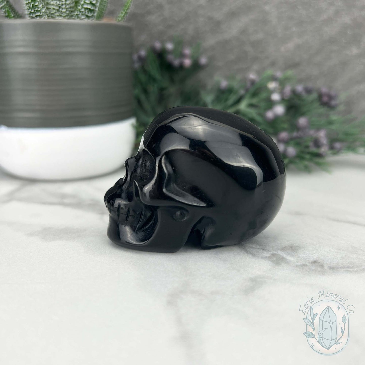 Polished Silver Sheen Obsidian Skull Carving