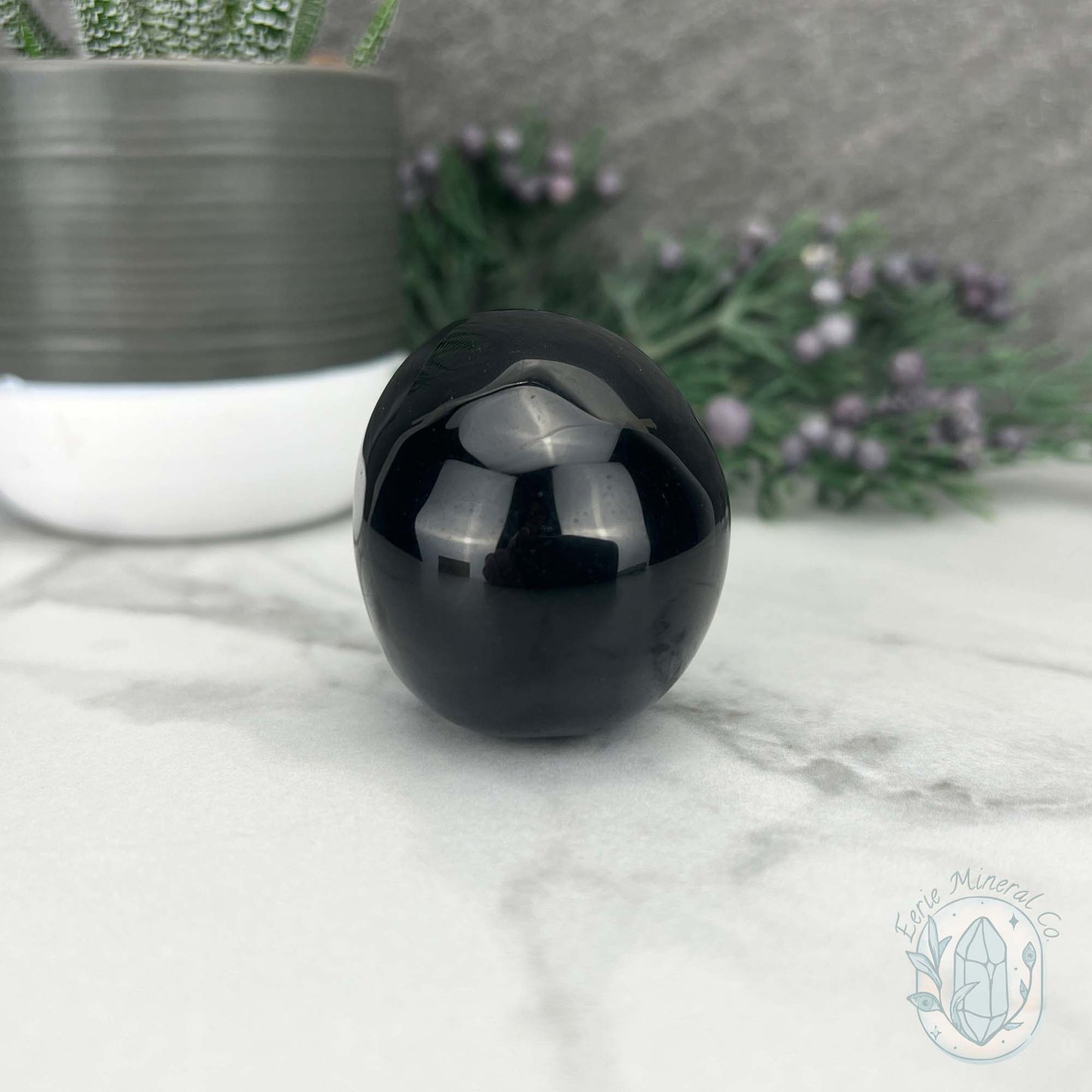 Polished Silver Sheen Obsidian Skull Carving