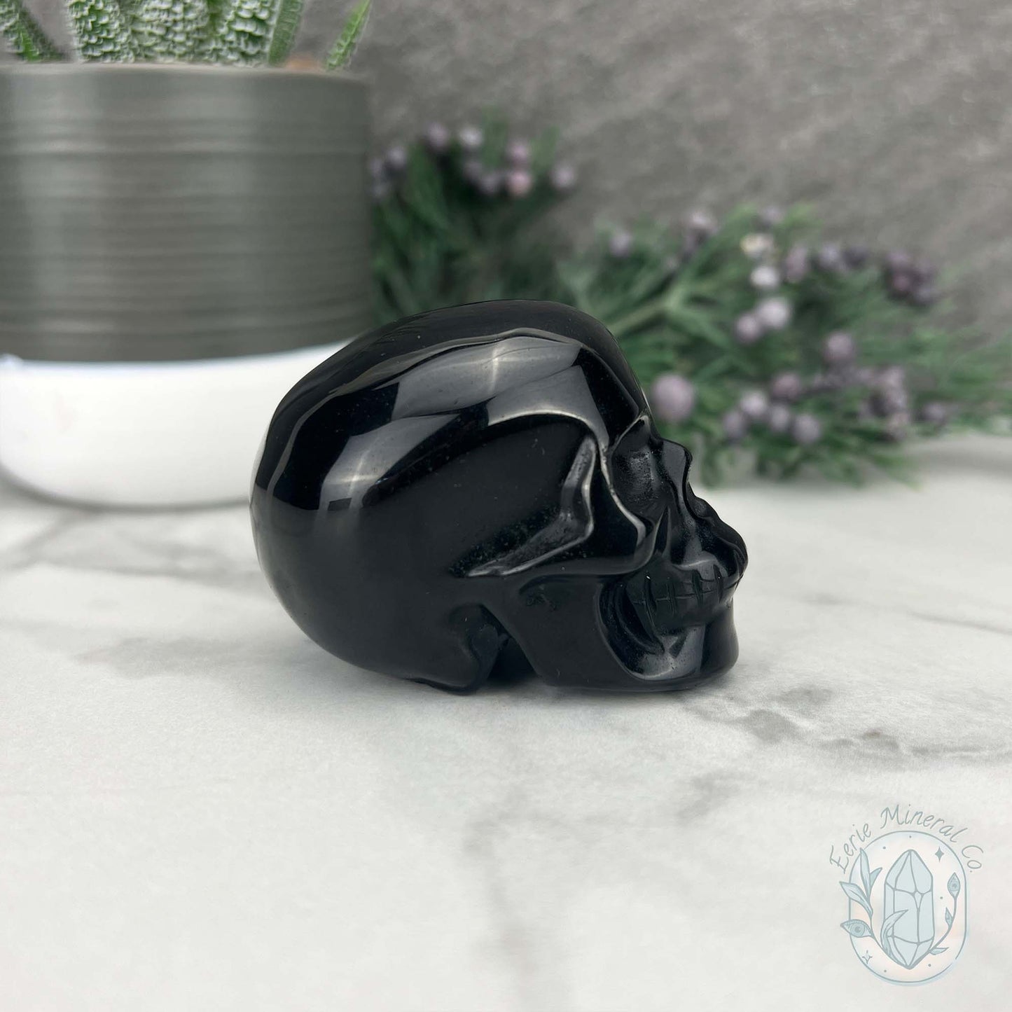 Polished Silver Sheen Obsidian Skull Carving