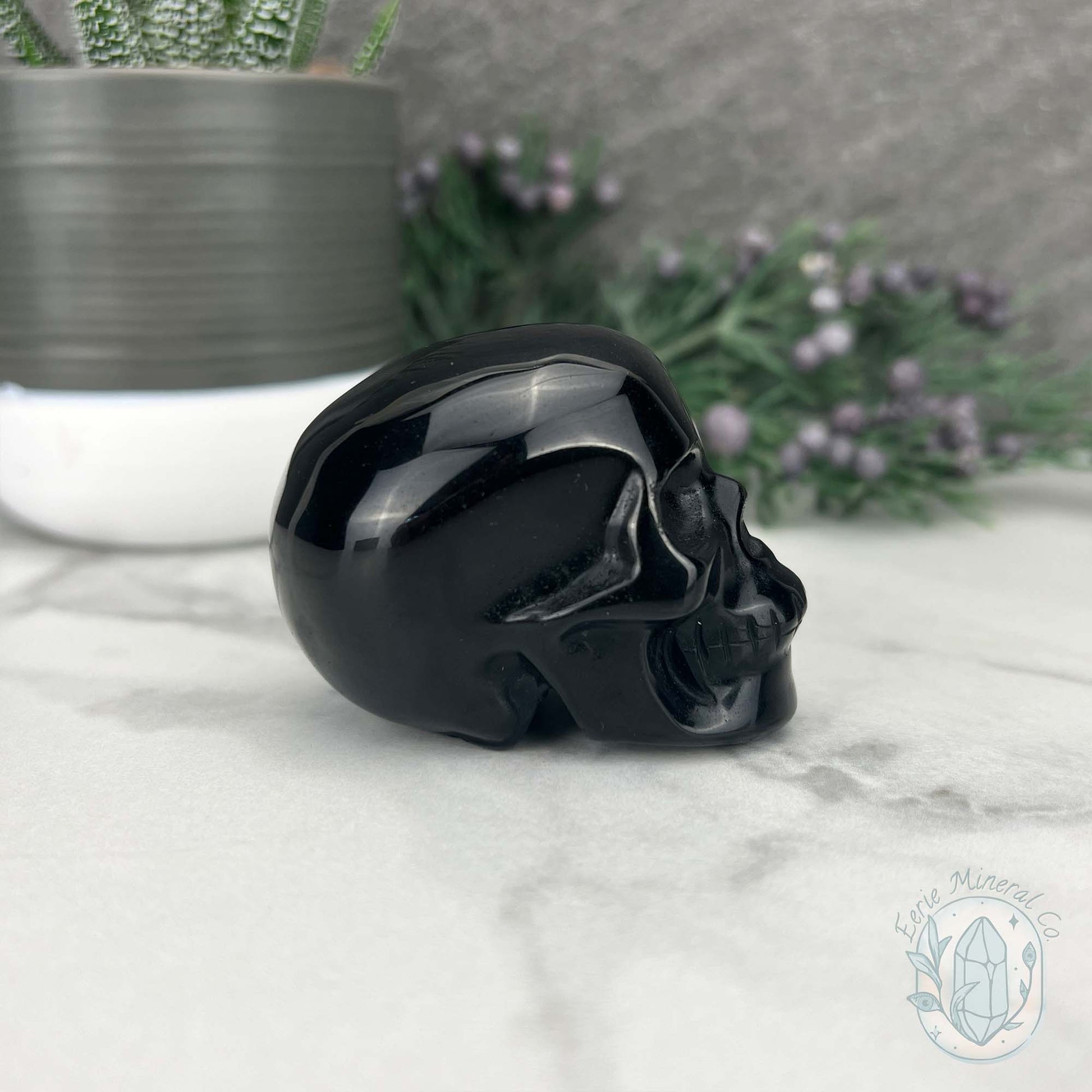Polished Silver Sheen Obsidian Skull Carving