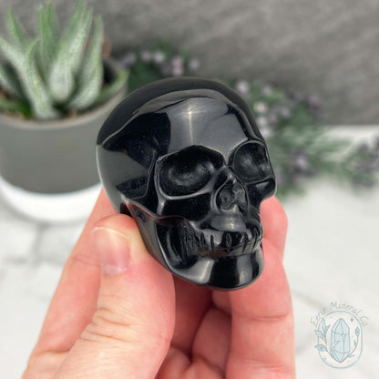 Polished Silver Sheen Obsidian Skull Carving