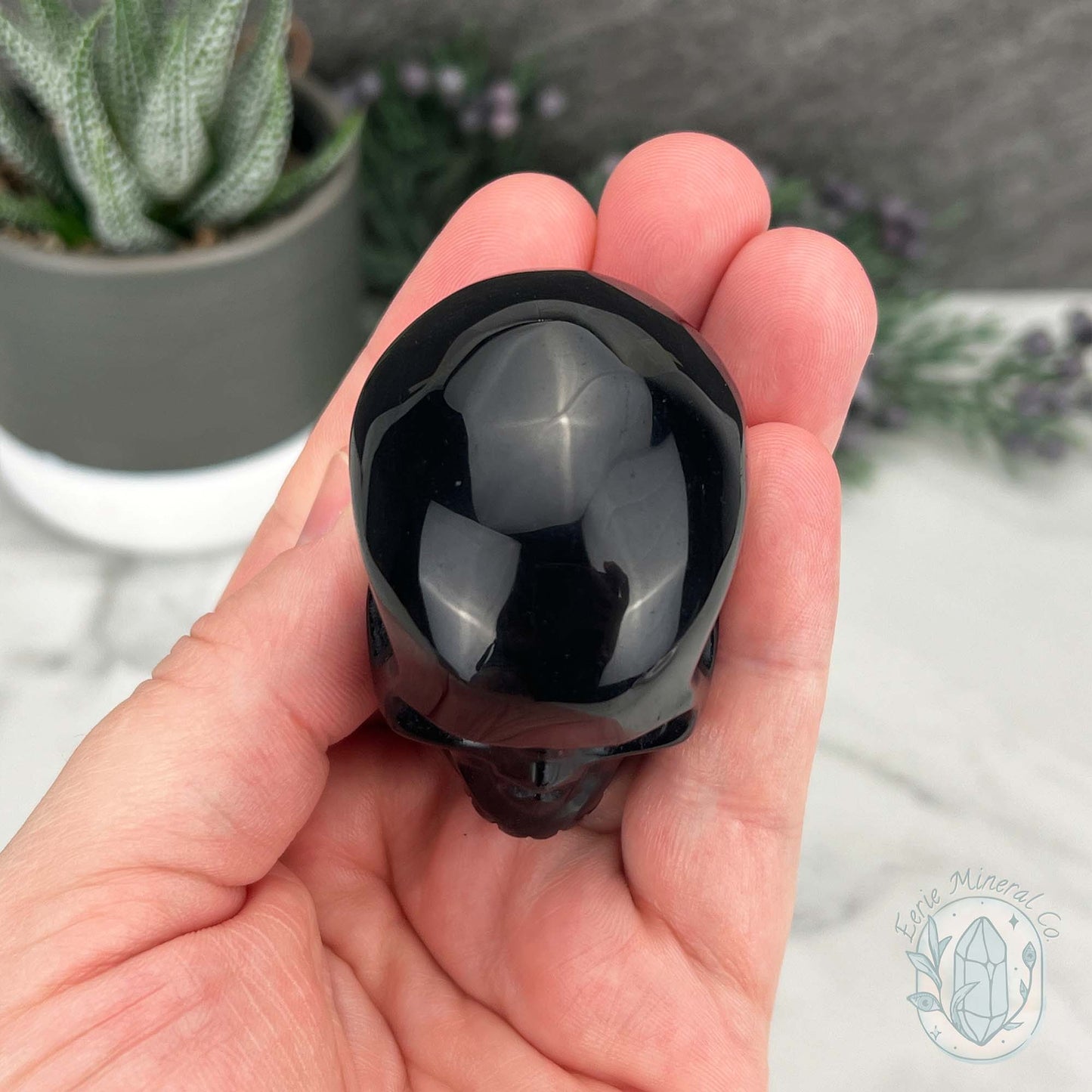 Polished Silver Sheen Obsidian Skull Carving