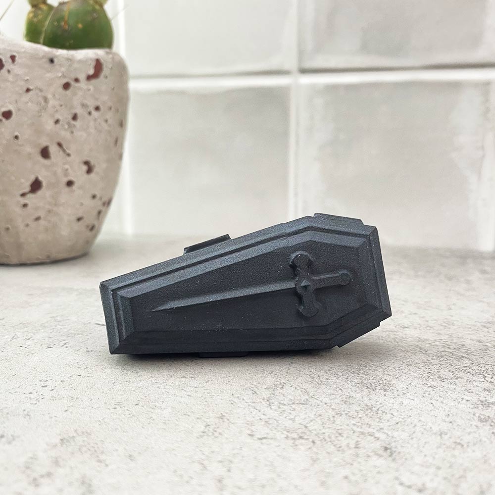 black obsidian coffin carving