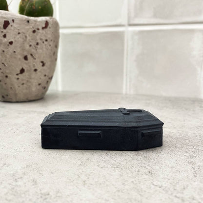 black obsidian coffin carving