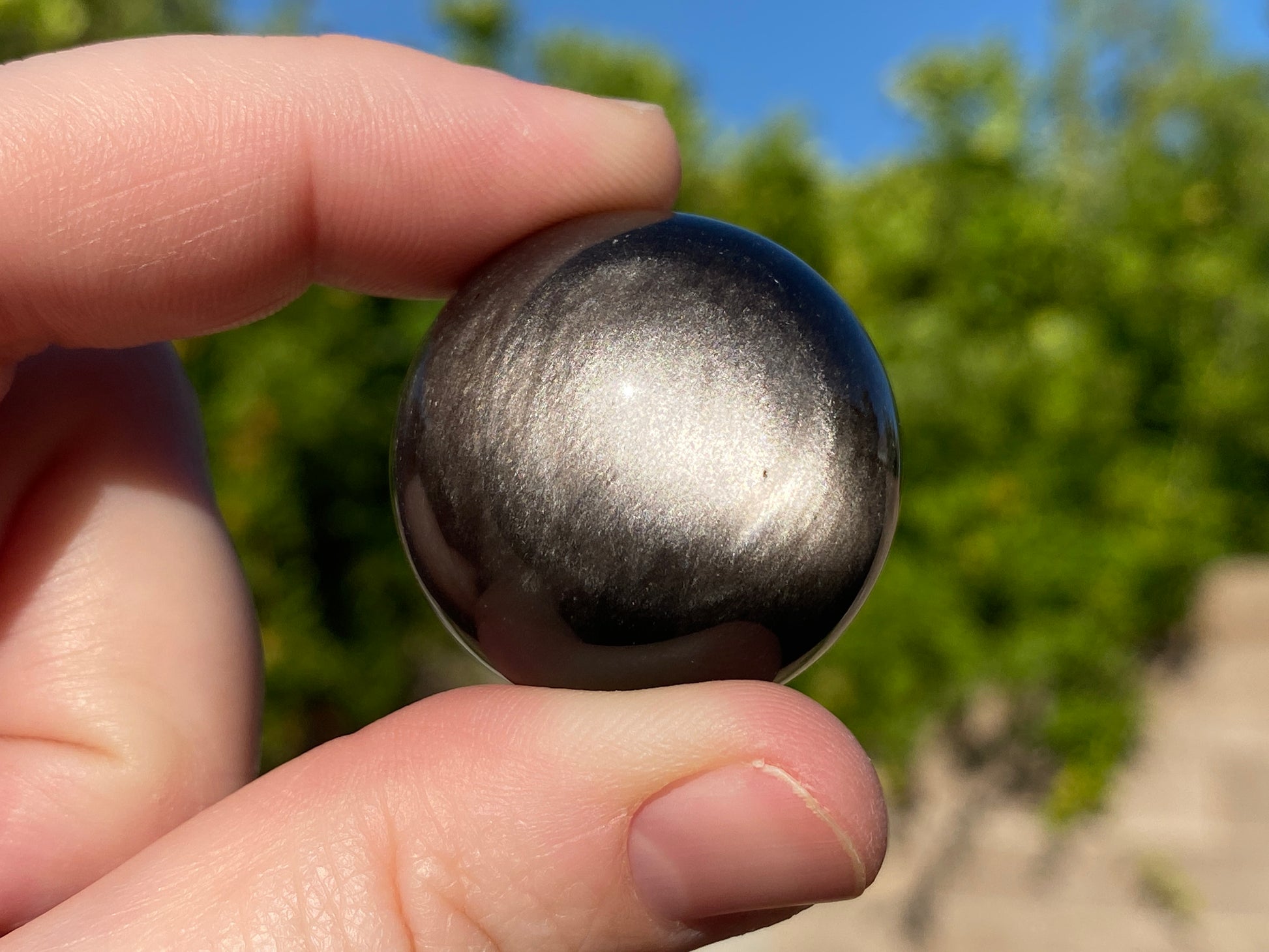 Silver sheen obsidian sphere