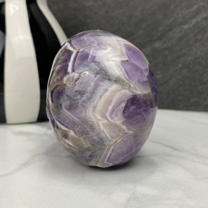 Polished Chevron (Dream) Amethyst Crystal Skull Carving