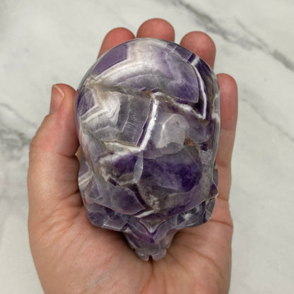Polished Chevron (Dream) Amethyst Crystal Skull Carving