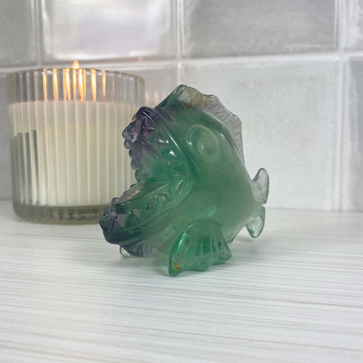 Polished Green and Purple Fluorite Piranha Carving