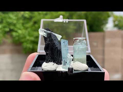 Aquamarine specimen group (3) with black tourmaline (1). This specimen group comes from The Republic of Namibia, Southern Africa.