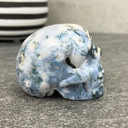 Polished Moss Agate Crystal Skull Carving