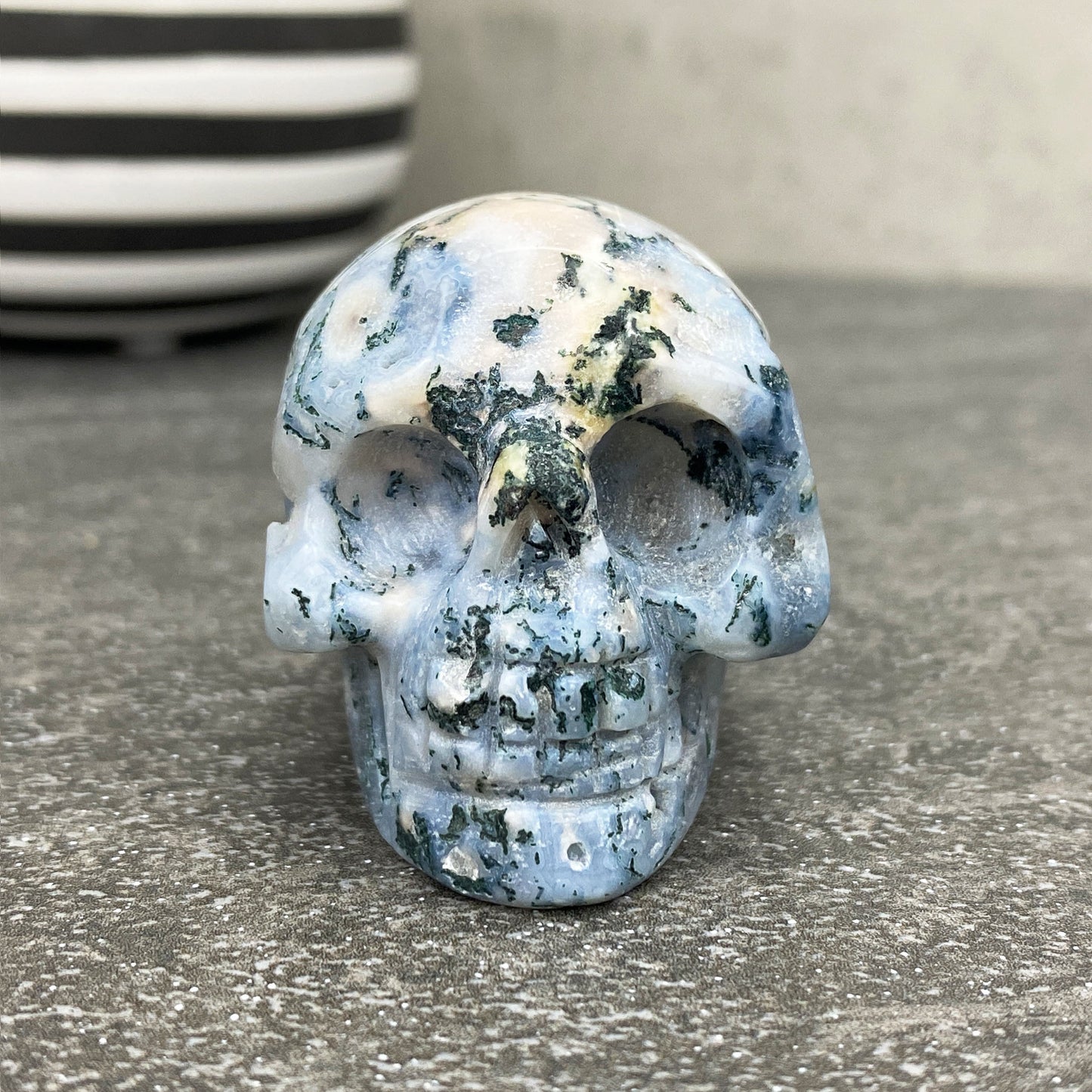 Polished Moss Agate Crystal Skull Carving