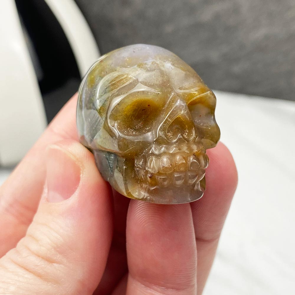 Polished Moss Agate Skull Carving