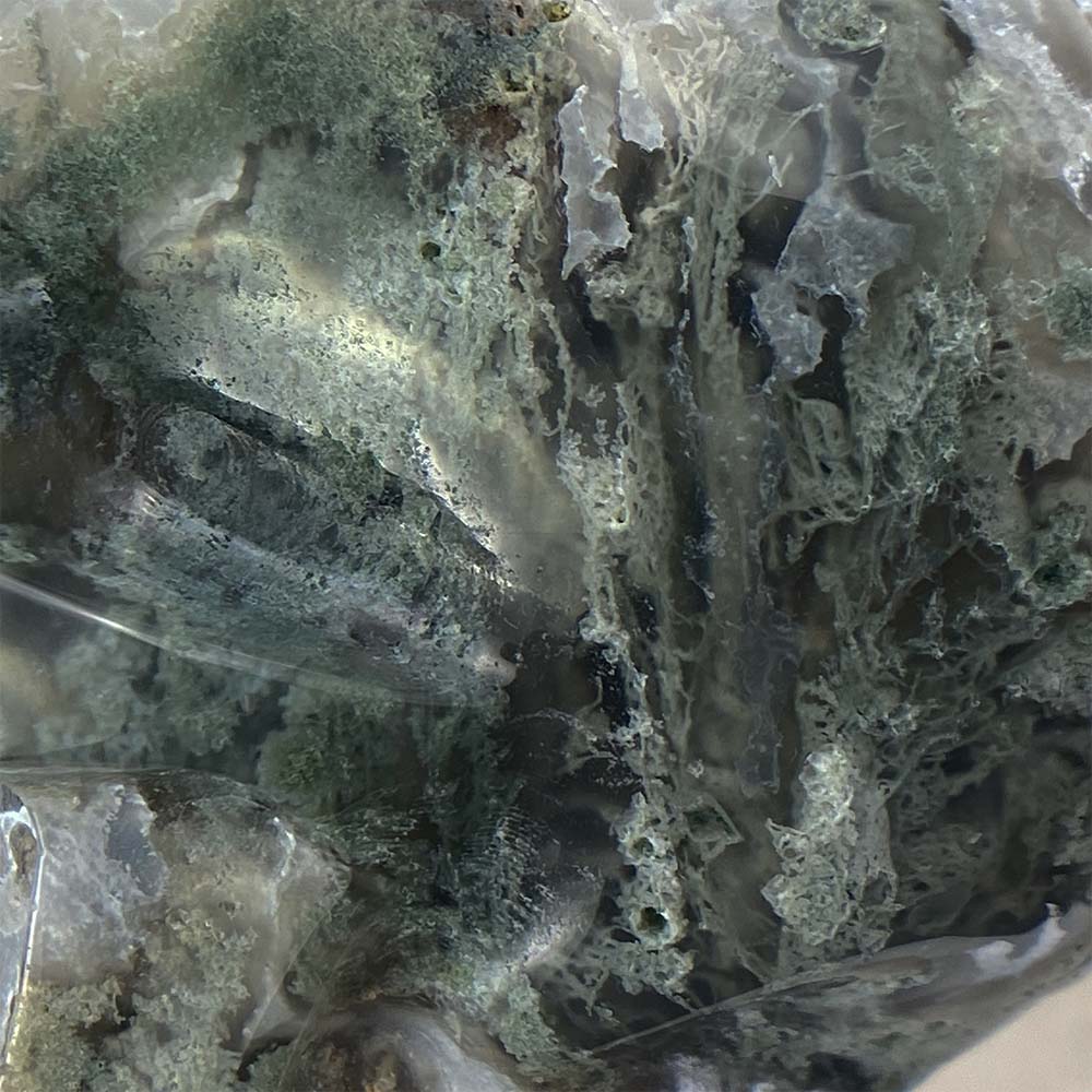 Polished Moss Agate Skull Carving