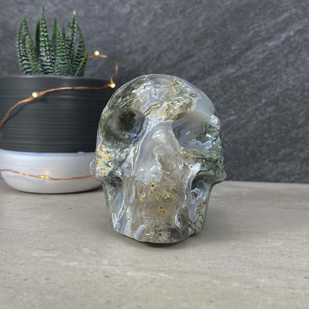 Polished Moss Agate Skull Carving