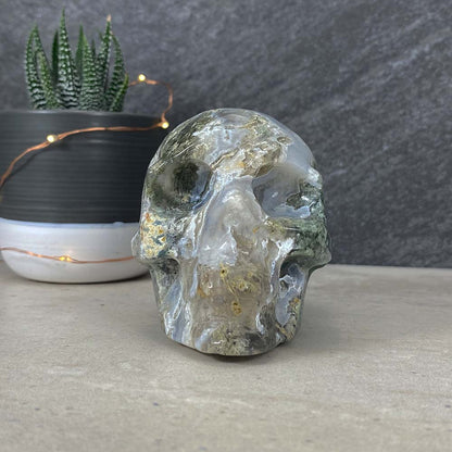 Polished Moss Agate Skull Carving