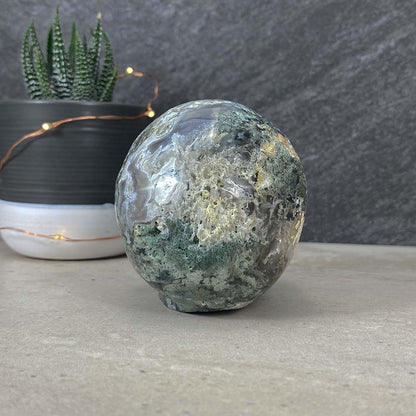 Polished Moss Agate Skull Carving