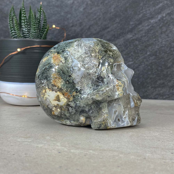 Polished Moss Agate Skull Carving