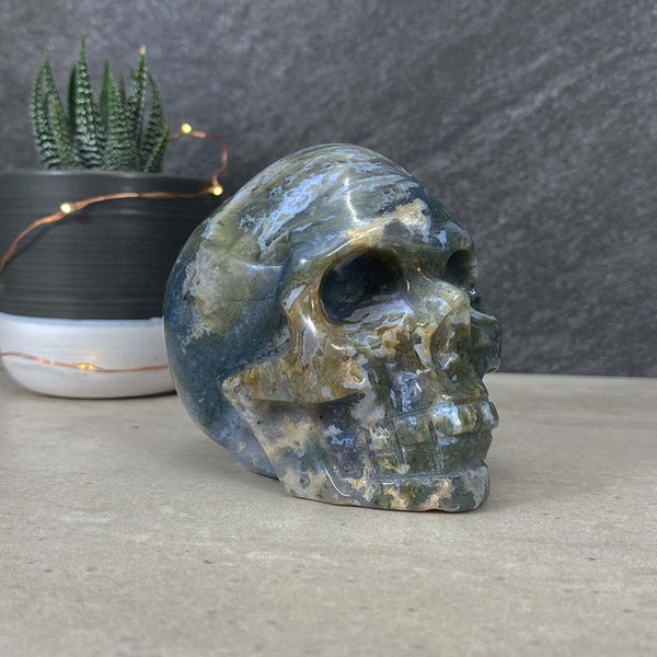 Polished Moss Agate Skull Carving