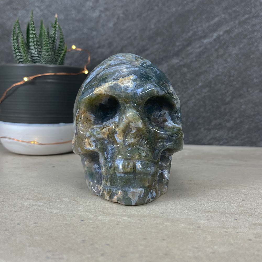 Polished Moss Agate Skull Carving