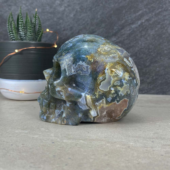 Polished Moss Agate Skull Carving