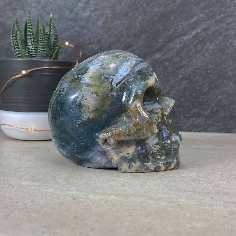Polished Moss Agate Skull Carving