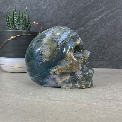 Polished Moss Agate Skull Carving