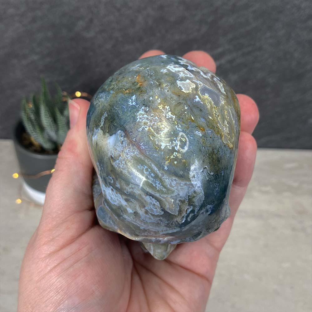 Polished Moss Agate Skull Carving