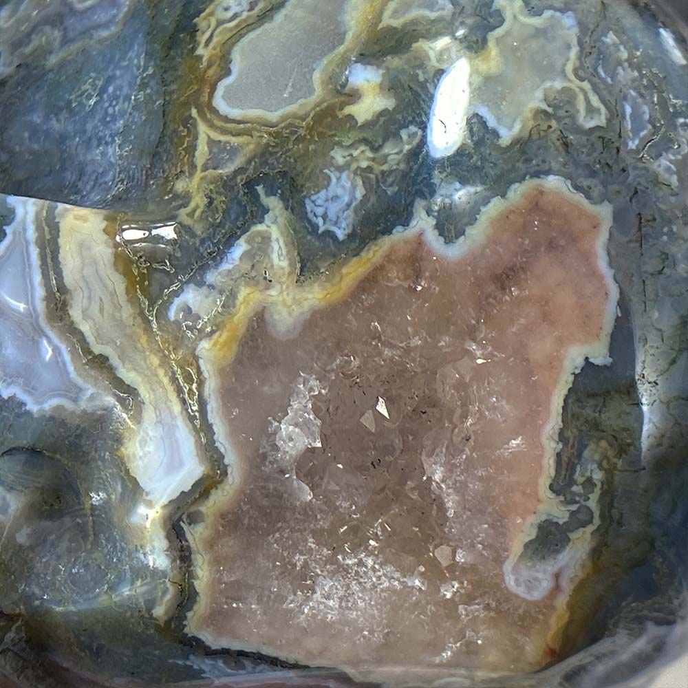 Polished Moss Agate Skull Carving