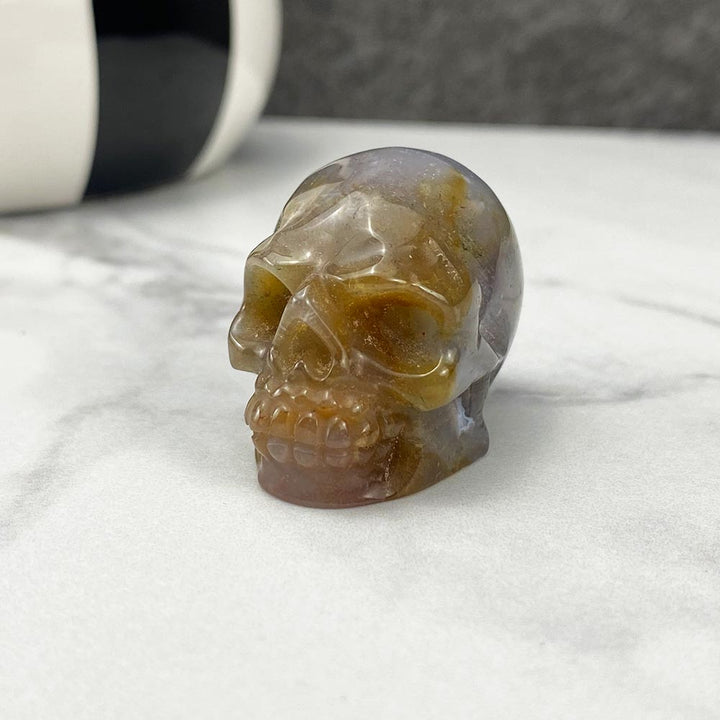 Polished Moss Agate Skull Carving