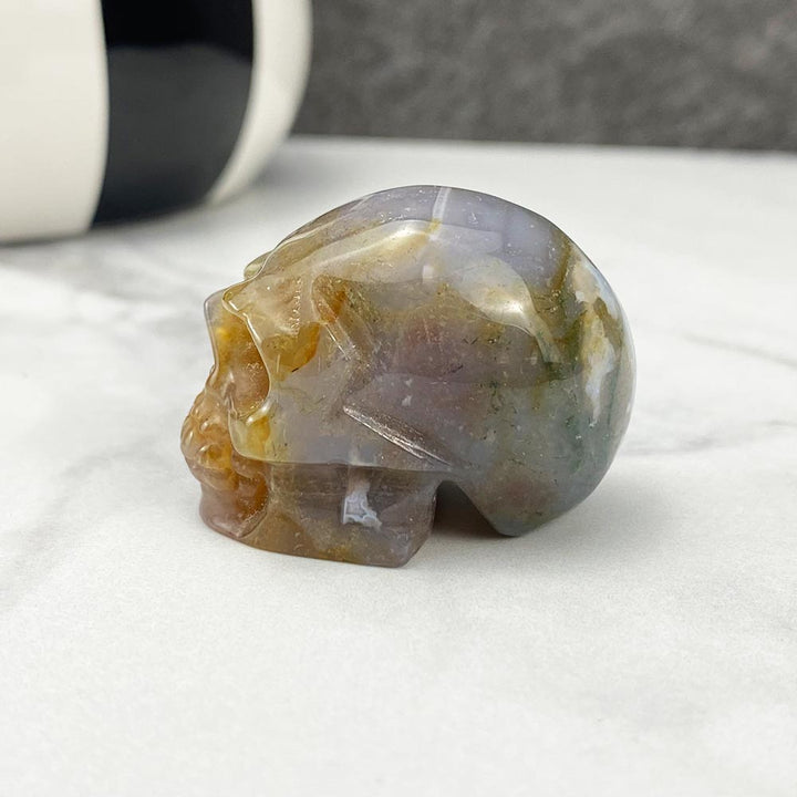 Polished Moss Agate Skull Carving